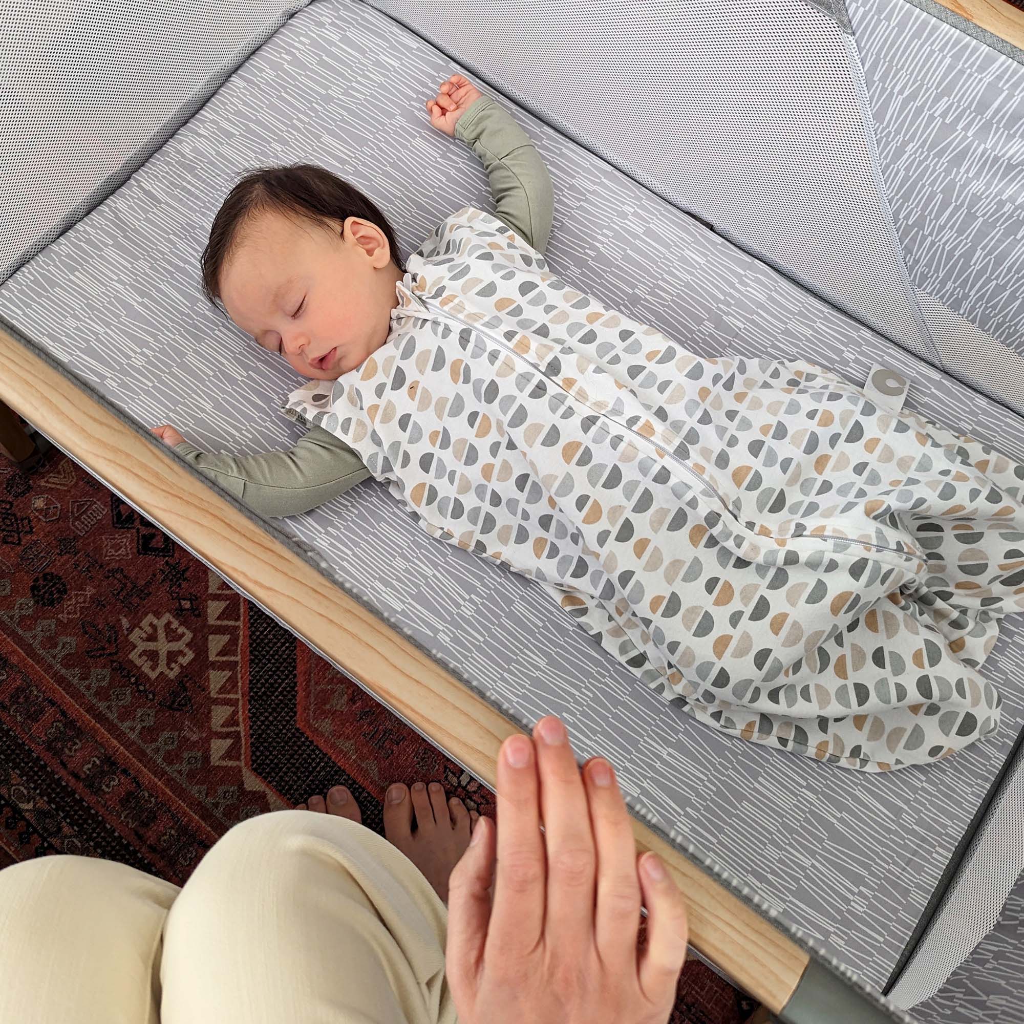 baby sleeping in bassinet