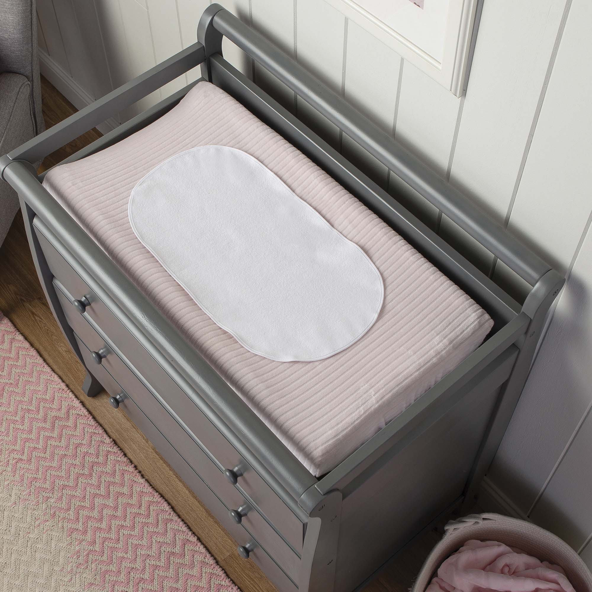 white changing pad liner on changing pad